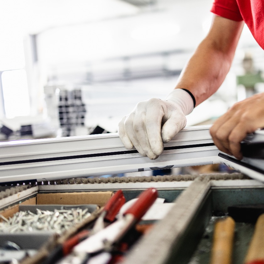 Manual worker assembling pvc doors and windows manufacturing jobs selective focus factory for aluminum and pvc windows and doors production jpg